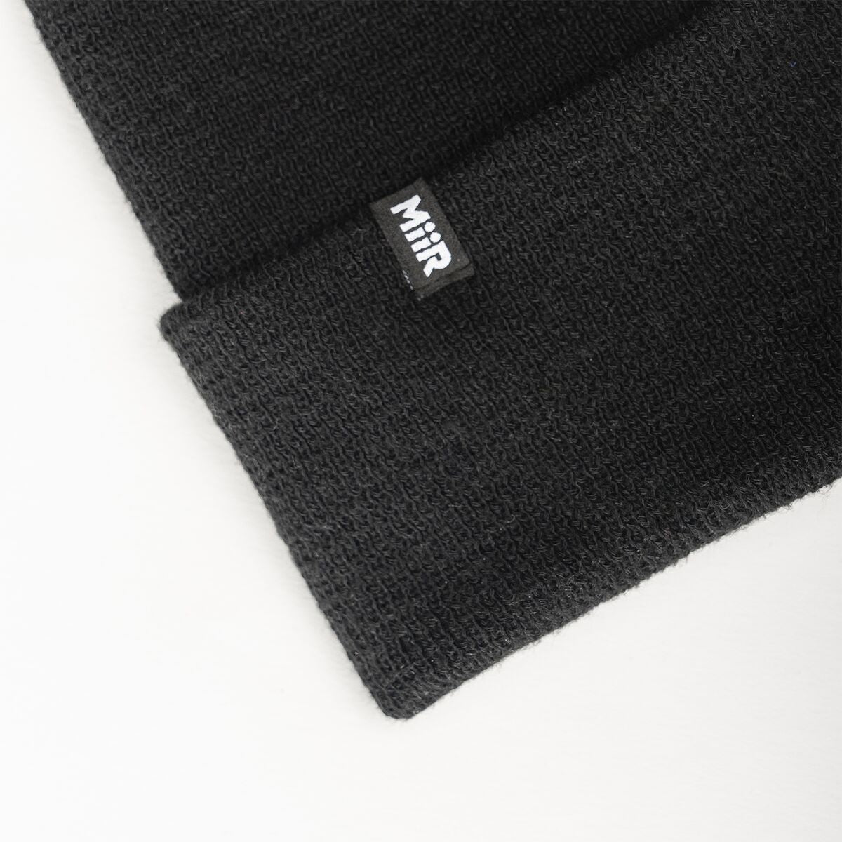 recycled-poly-fine-knit-beanie-b8 WebPDP-RecycledPolyFineKnitBeanie_Studio_TagDetail_Black__BNE005002OS.jpg